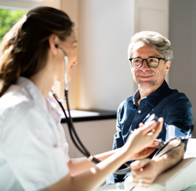 Man undergoing checkup with his primary care physician