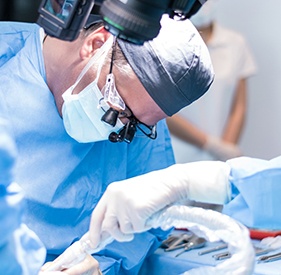 Oral surgery team carefully working on patient