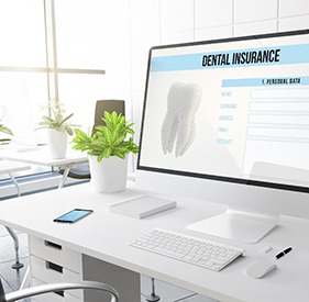 Dental insurance form displayed on large computer monitor