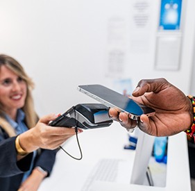 Dental team member accepting payment from patient