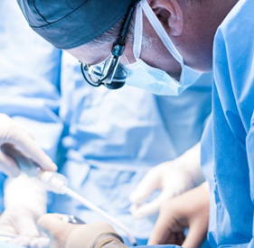 Surgical team carefully working on patient