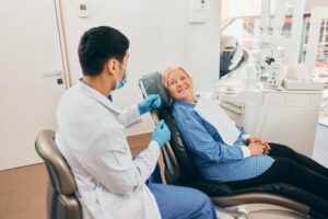 Dentist and patient talking during consultation 
